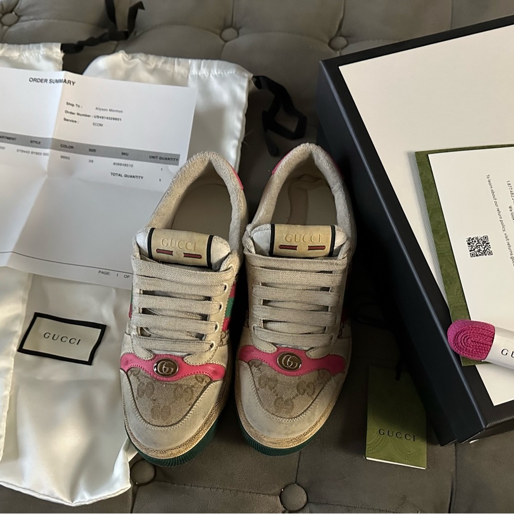 Gucci Women's Screener leather sneaker with pink accents.